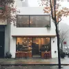 创造一个高度形象、拍摄坦率、极简主义的咖啡馆店面，早上有雾，秋天，建筑应该以干净的线条为特色