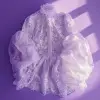 低角度拍摄一件精致、浪漫、空灵的设计师白色蕾丝衬衫，配有蓬松袖子和扇形褶边，由Marcel Wanders设计，前视图，熏衣草背景：：2 --q 2
