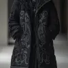 《Vogue Runway》，一位亚洲女性的全身肖像，穿着带兜帽的黑色冬季外套和大号刺绣装饰品，穿着白色运动鞋。以亚洲女性的风格--ar 1：2 --styminster 750