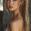 celebrity portrait of a beautiful woman with long light brown hair, wearing a backless outfit, looking over her shoulder at the camera, posted on snapchat, casual flirty smile, wearing her hair in a p