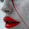 一个化着红眼妆的女人，作品风格受日本风影响，daz 3d，黑白精通，日本风格的艺术，浅灰色和红色，独特的鼻子，敏锐的焦点--ar 69：128 --styleston 750 --v 6