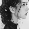 Japanese ink drawing of a stunning Japanese woman, side view, face only, traditional attire --ar 68:128 --stylize 750 --v 6
