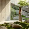 摄影、宁静的禅宗花园场景、现代建筑环境、极简主义花园以充满活力的绿苔和光滑的灰色河石为特色，精心排列成线性图案。周围墙壁赤裸裸、干净的混凝土，有一个大的长方形开口，揭示了一个宁静、封闭的空间，整体氛围宁静和现代优雅，一名女模特站立，UHD，详细说明--ar 9：16 --风格原始--styminster 300