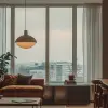 摄影、极简主义、与视线齐平的前拍、全画幅单反、公寓客厅，空间颜色仅限于棕色、米色和白色，USM Haller钢制低控制台，简单的落地支架灯，带环境照明的家具，线条干净，中性色调与木地板相匹配，大窗户投射柔和的漫反射光，窗外的城市景观，旨在捕捉自然光和人造光的相互作用，现实主义阳光，天花板简单而整齐地排列，带有温暖的白色间接光，灯光下温暖的对比，UHD -ar 9：16 -原始风格
