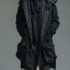 照片，正视图，全身拍摄，专业模特，男性，金发Undercut发型，站在纯灰色背景上，凝视相机，额头有皱纹，由Richard Avedon风格，使用的相机是索尼阿尔法9 II，配备索尼FE 100- 400 mm f/4.5-5.6 GM OSS镜头，穿着黑色长袖羊毛衫搭配哑光黑色连帽衫，深灰色货物慢跑裤，Nike Killshot运动鞋和白色鞋带，逼真的摄影，高对比度--ar 9：16 --sty