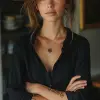 a woman in black shirt with her arms folded against , in the style of tattoo, normcore, dark silver and dark gold, happycore, focus on joints/connections, effortlessly chic, palewave --ar 9:16 --styli