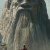 女人站在一座巨大的雕像前，以电影布景的风格，Fenghua Zhong，alessio albi，红色和灰色，cliff chiang，电影/视频，细致的技巧--ar 35：64 --styleum 750 --v6