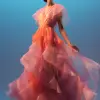连衣裙设计的前视图，腰部有飘逸的裙子和褶边袖子，从侧面拍摄，由Cristobal Balenciaga设计，充满活力的配色方案，Crepuscular光芒，干净的粉色背景：：2，辛烷渲染，V-ray -ar 2：3 --v 5.1 --q 2 --没有人体模特