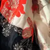 优雅、奢华、现代的设计师丝绸连衣裙，带有花卉图案和串珠装饰，由Andre-Charles Boulle设计，以白色缎面为背景：：2 --q 2 --ar 2：3
