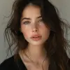 a beautiful young woman in black with long hair, in the style of textural layers, reefwave, light brown and light black, wet-on-wet blending, wavy, pop inspo, captivating gaze --ar 74:97 --stylize 750