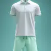 春季网球训练，男士白色运动Polo搭配浅绿短裤，清新配色，经典运动风格，Polo领口与袖口细节突出，晨曦下衣物明亮，服饰设计效果图     --ar 3:4