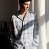 春季周末早晨，男士棉质长袖睡衣配格纹睡裤，浅蓝与白色调，舒适家居风格，睡衣纽扣与口袋细节，窗外晨光柔和照射，服饰设计效果图     --ar 3:4